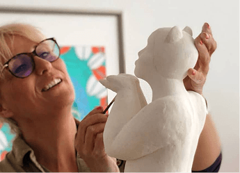 Person holding sculpture